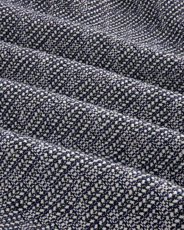 Close-up of the Textured Zip Shirt’s navy blue and white woven fabric with a diagonal checkered pattern and soft folds.