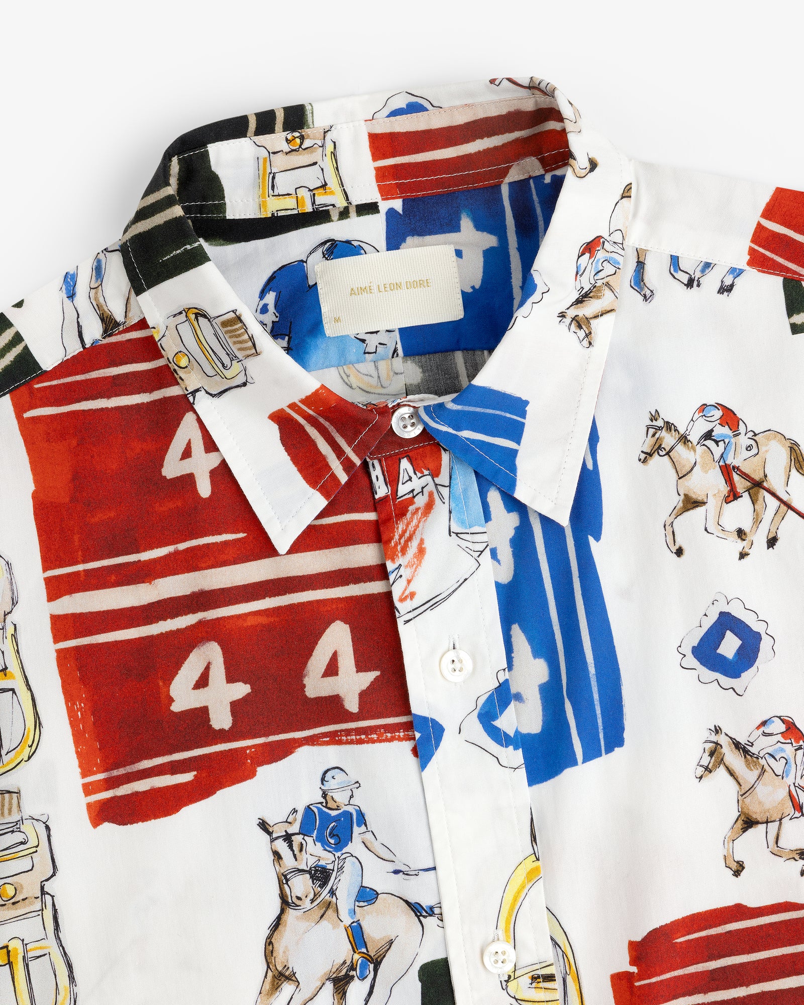 Printed Leon Overshirt featuring colorful horse, polo player, red and blue numbers, and abstract prints.
