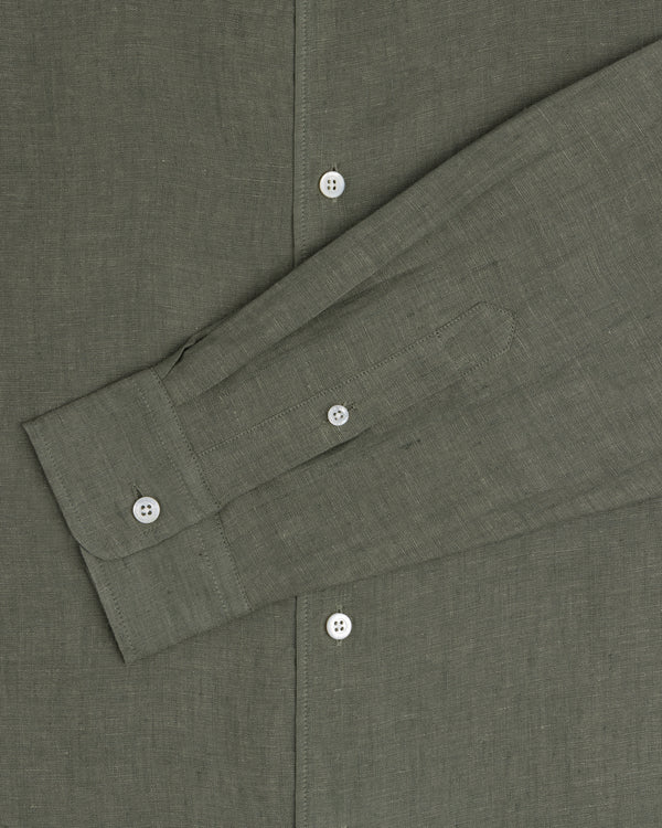 A close-up of the Long-Sleeve Linen Shirt in olive green with white buttons and a buttoned cuff.