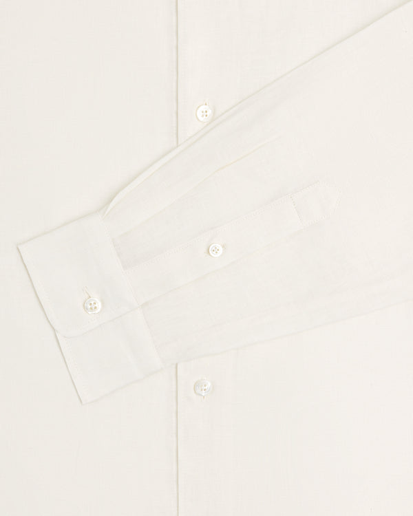 A close-up of the Long-Sleeve Linen Shirt displays its sleeve, cuff, and buttons against a light background.
