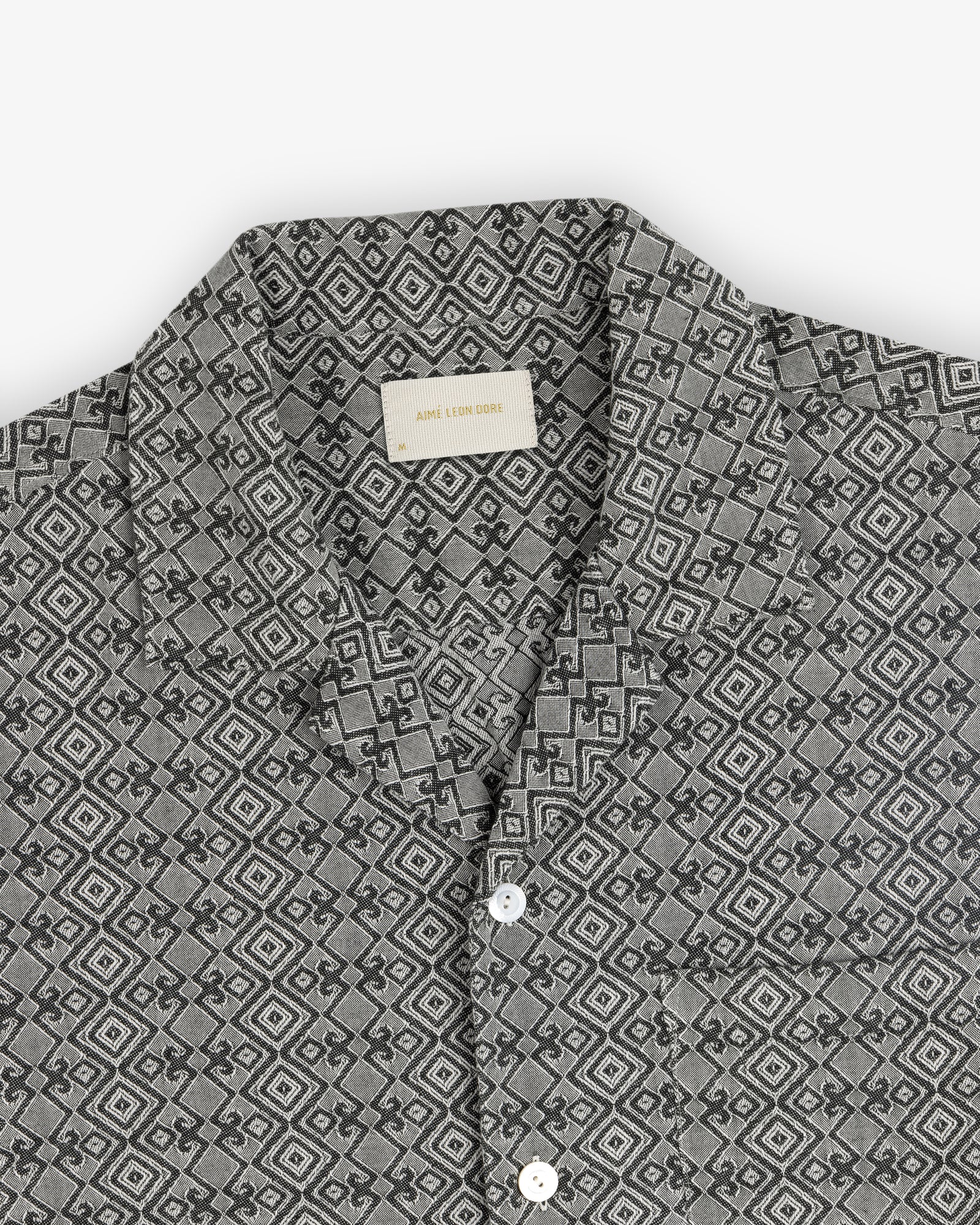 Jacquard Leisure Shirt in gray with a geometric diamond pattern and white buttons, laid flat on a white background.