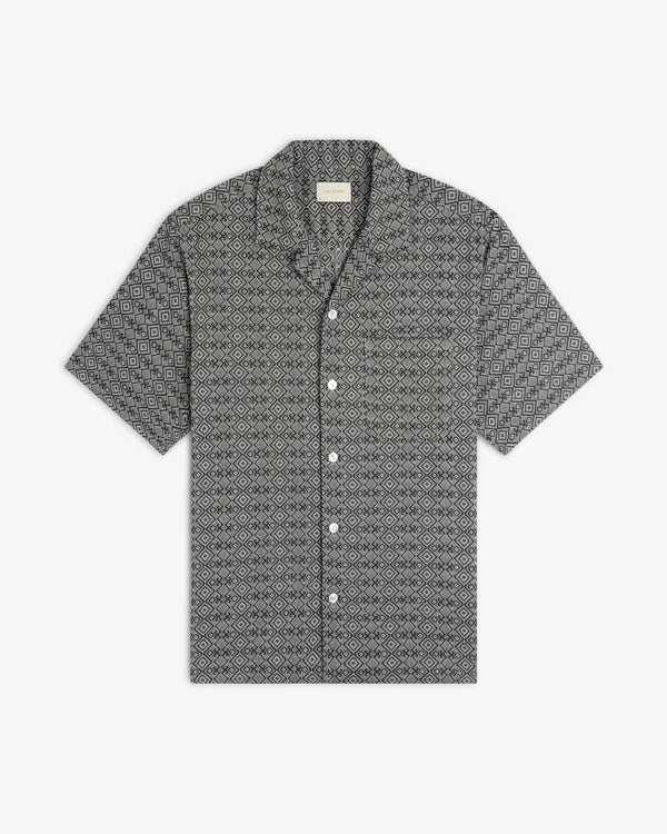 The Jacquard Leisure Shirt, featuring a black and white geometric diamond pattern, is laid flat on a white background.