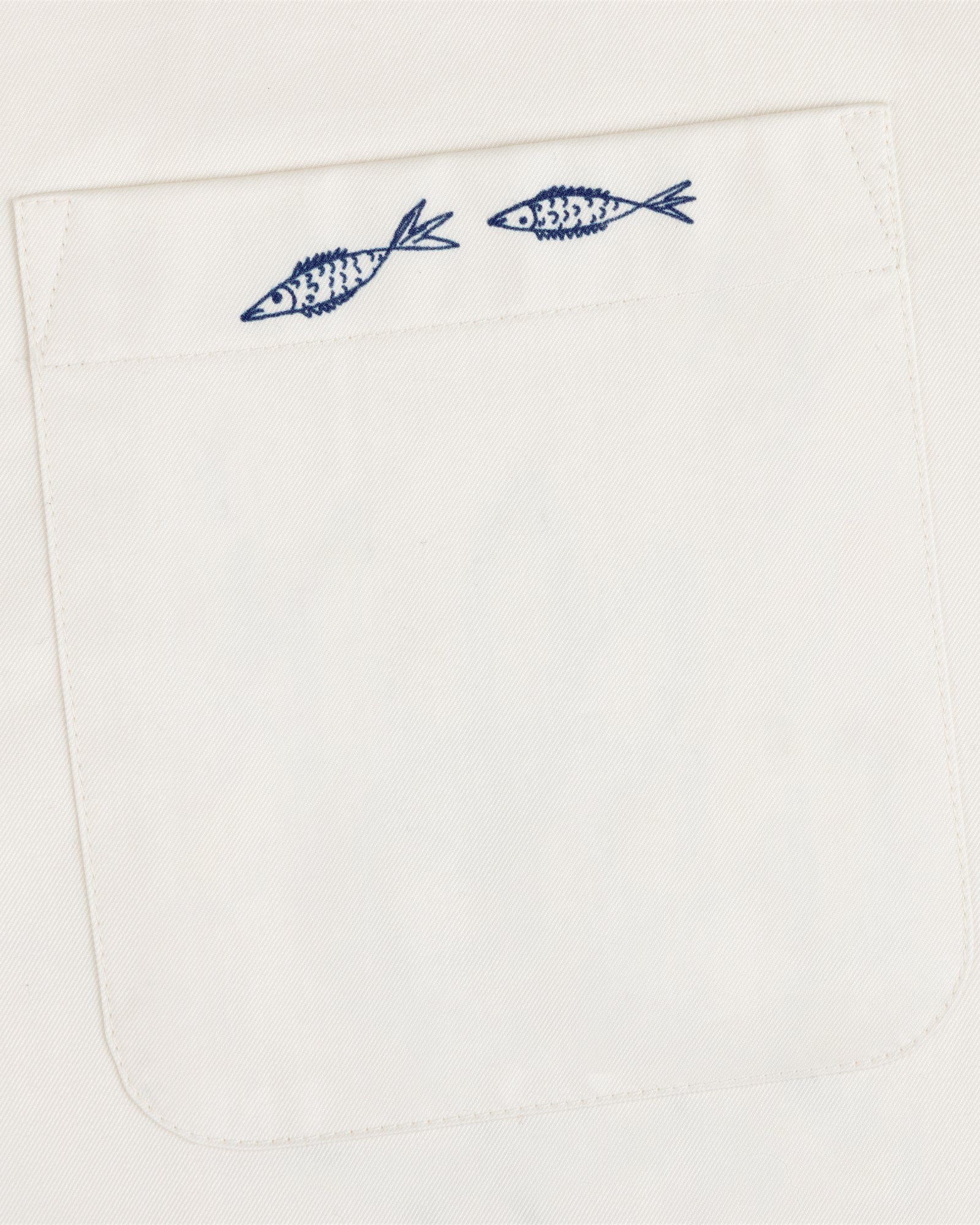 The Fassianos "Rendez-Vous" Camp Shirt features a white fabric pocket with two small blue fish above the opening.