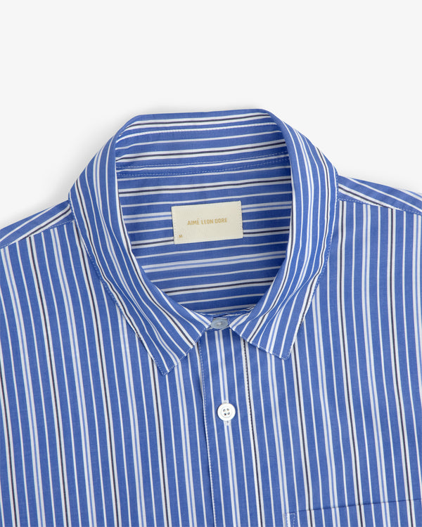 Aimé Leon Dore Yarn Dyed Striped Shirt in blue, spread collar, chest pocket, size M.