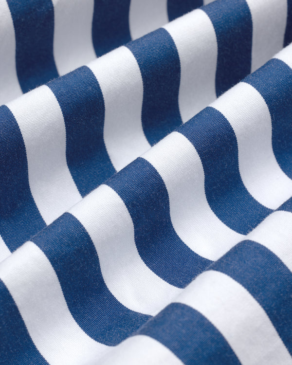 Close-up of the Striped Leon Overshirt’s blue and white stripes with gentle folds forming a wavy pattern.