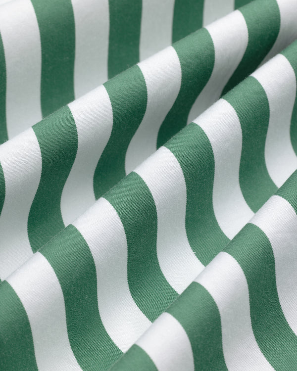 Green and white wavy stripes create a textured, repetitive pattern on the Striped Leon Overshirt fabric.