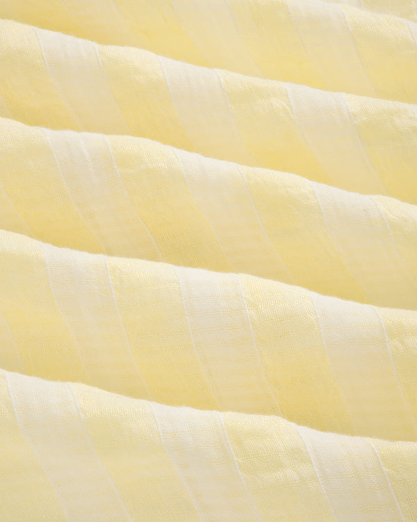 Close-up of the Linen Blend Striped Camp Shirt featuring light yellow and white stripes with a soft, textured surface.