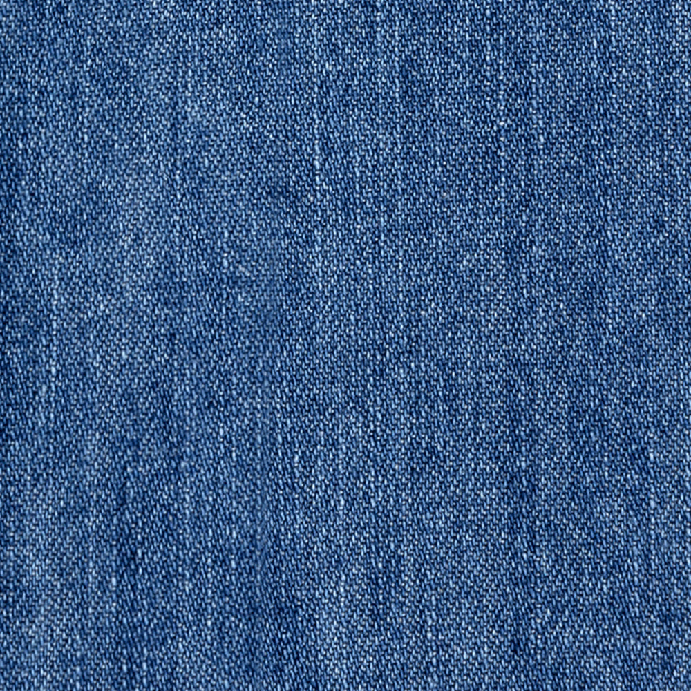Close-up of the Crest Chambray Shirt, highlighting its blue denim fabric's detailed weave and textured surface.