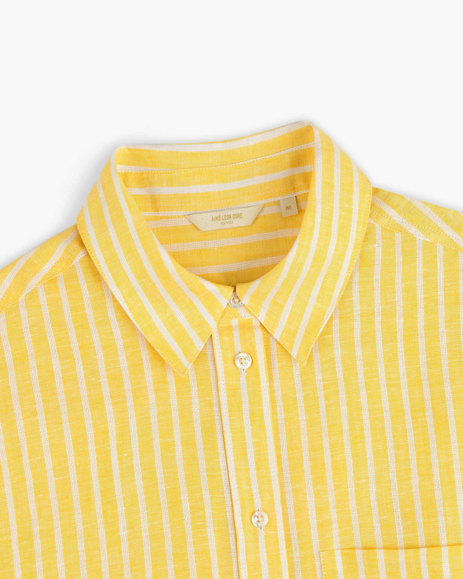Striped Linen Casual Shirt in yellow with white vertical stripes and buttons, displayed on a white background.