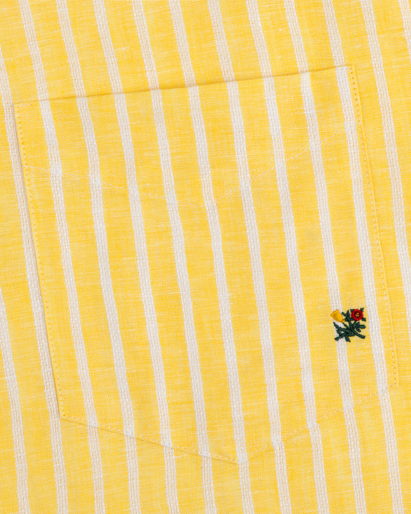 Striped Linen Casual Shirt with yellow and white stripes and a small embroidered flower by the pocket.