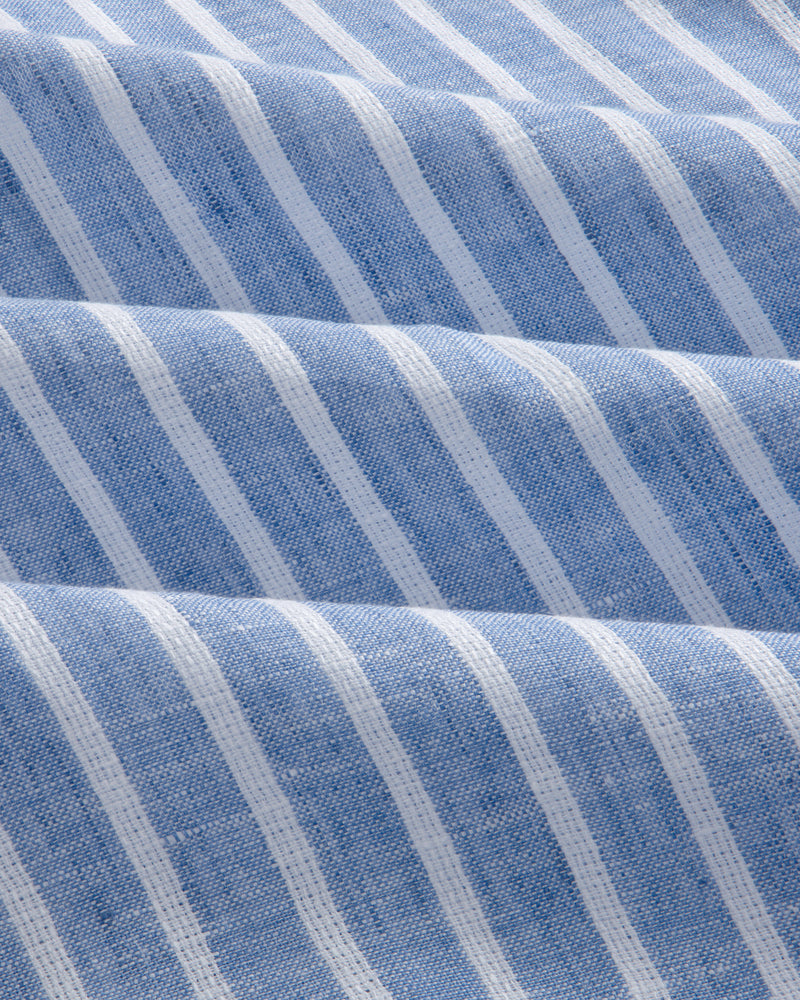 The Striped Linen Casual Shirt features blue and white stripes with soft waves and a textured look.