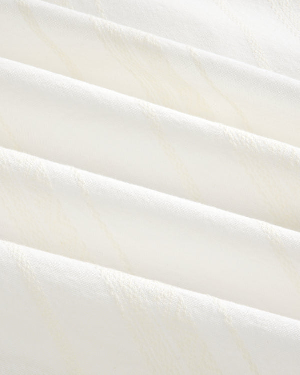 Close-up of the Jacquard Striped Tie-Front Shirt’s soft white fabric with subtle diagonal textured lines.