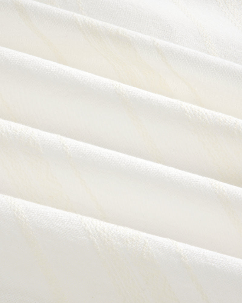 Close-up of the Jacquard Striped Tie-Front Shirt’s soft white fabric with subtle diagonal textured lines.