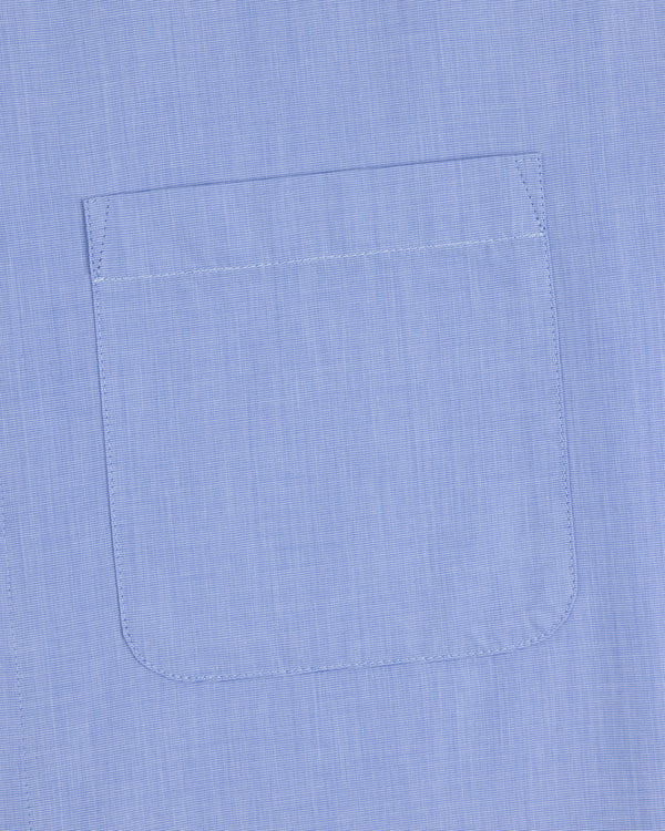 Poplin Casual Shirt in light blue with a single chest pocket and visible stitching at the pocket edges.
