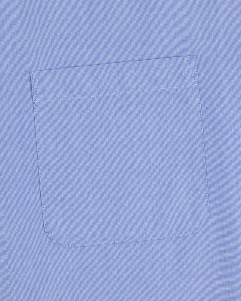 Poplin Casual Shirt in light blue with a single chest pocket and visible stitching at the pocket edges.