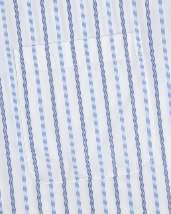 A close-up of the pocket on a Poplin Casual Shirt with vertical blue and light blue stripes on white fabric.