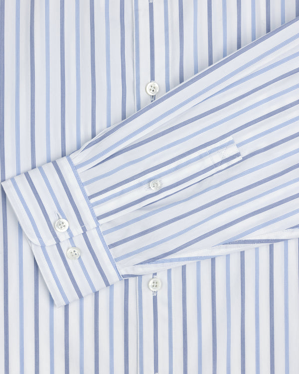 Close-up of a Poplin Casual Shirt, white with blue vertical stripes and white buttons on the cuff and front.