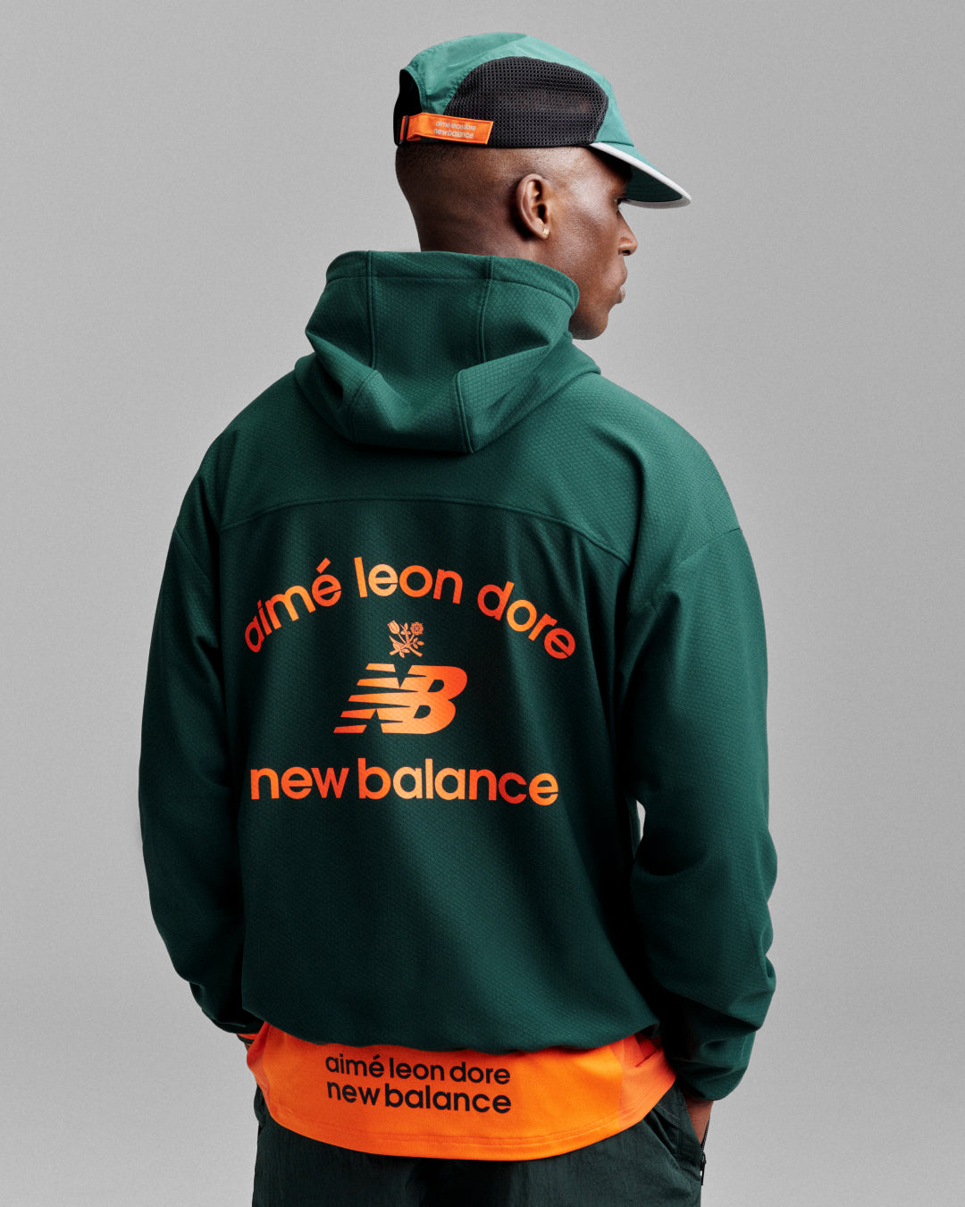 back view of man wearing hat and sweatshirt