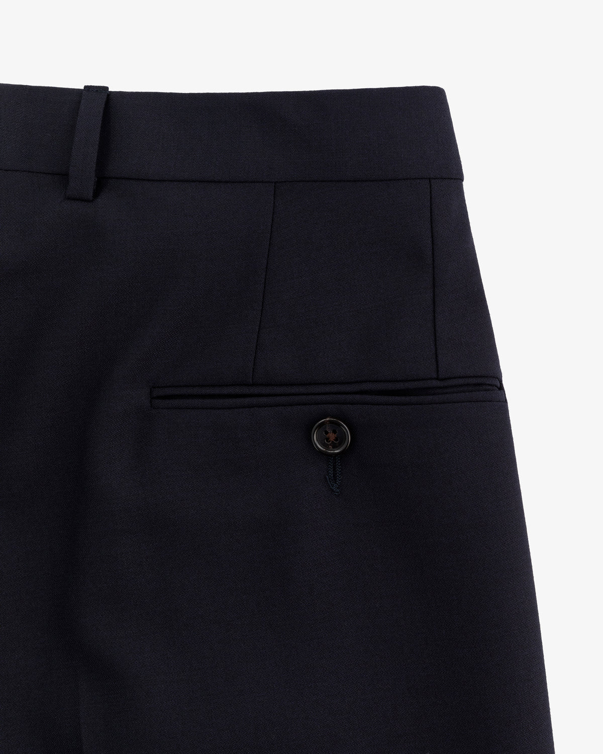 Close-up of Tropical Wool Suit Trouser showing waistband, belt loop, and back pocket with button closure.