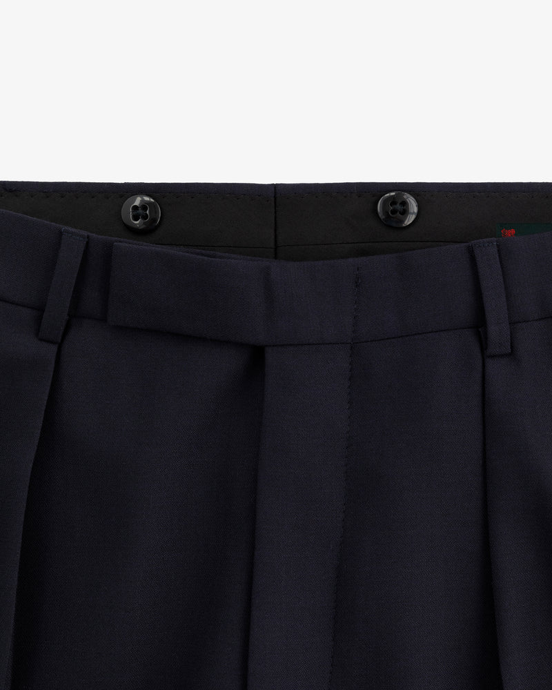 Close-up of the waistband and top front of Tropical Wool Suit Trouser in navy with belt loops and two black buttons.