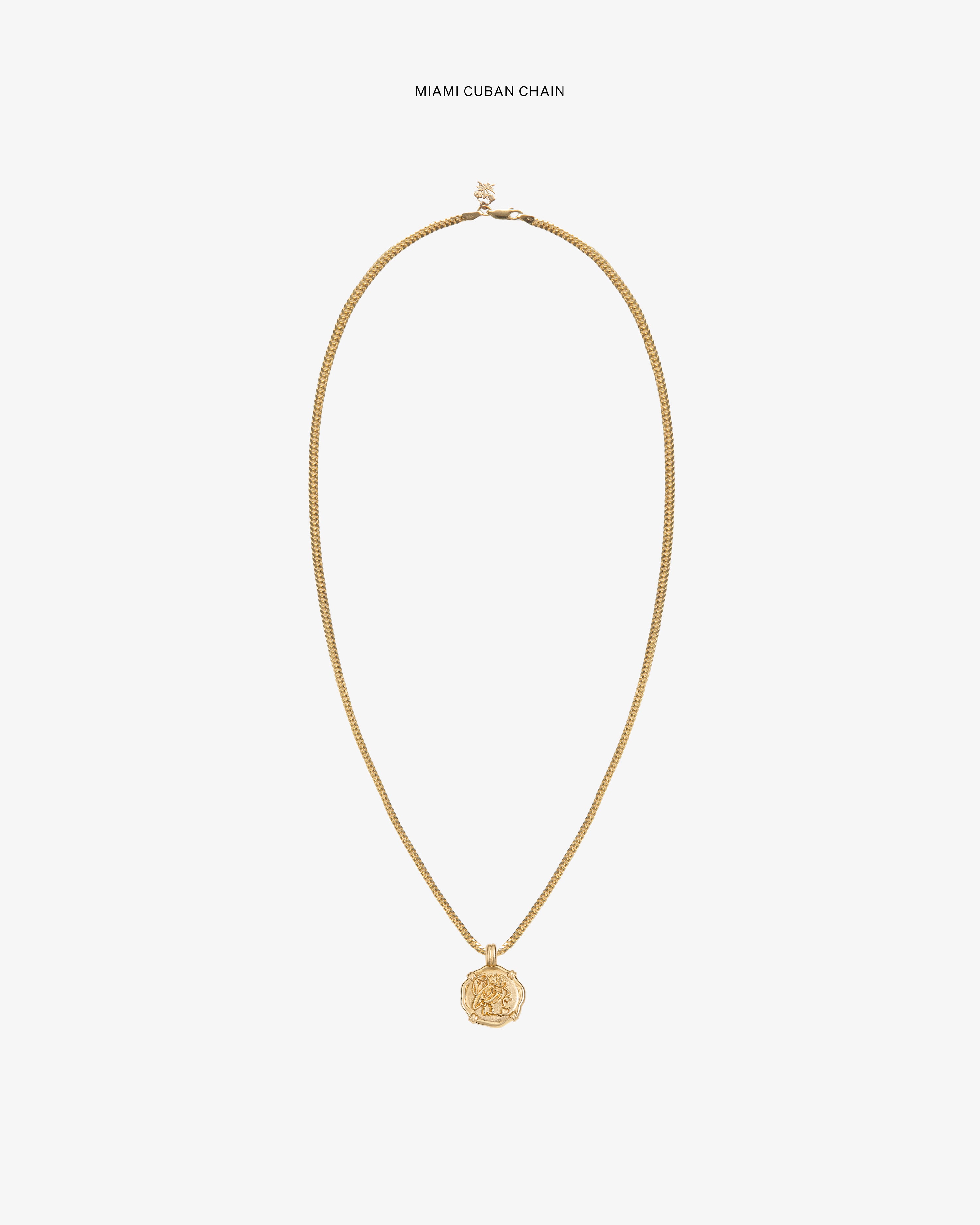 14Kt Gold Coin Pendant on a Miami Cuban chain, showcased against a plain white background.