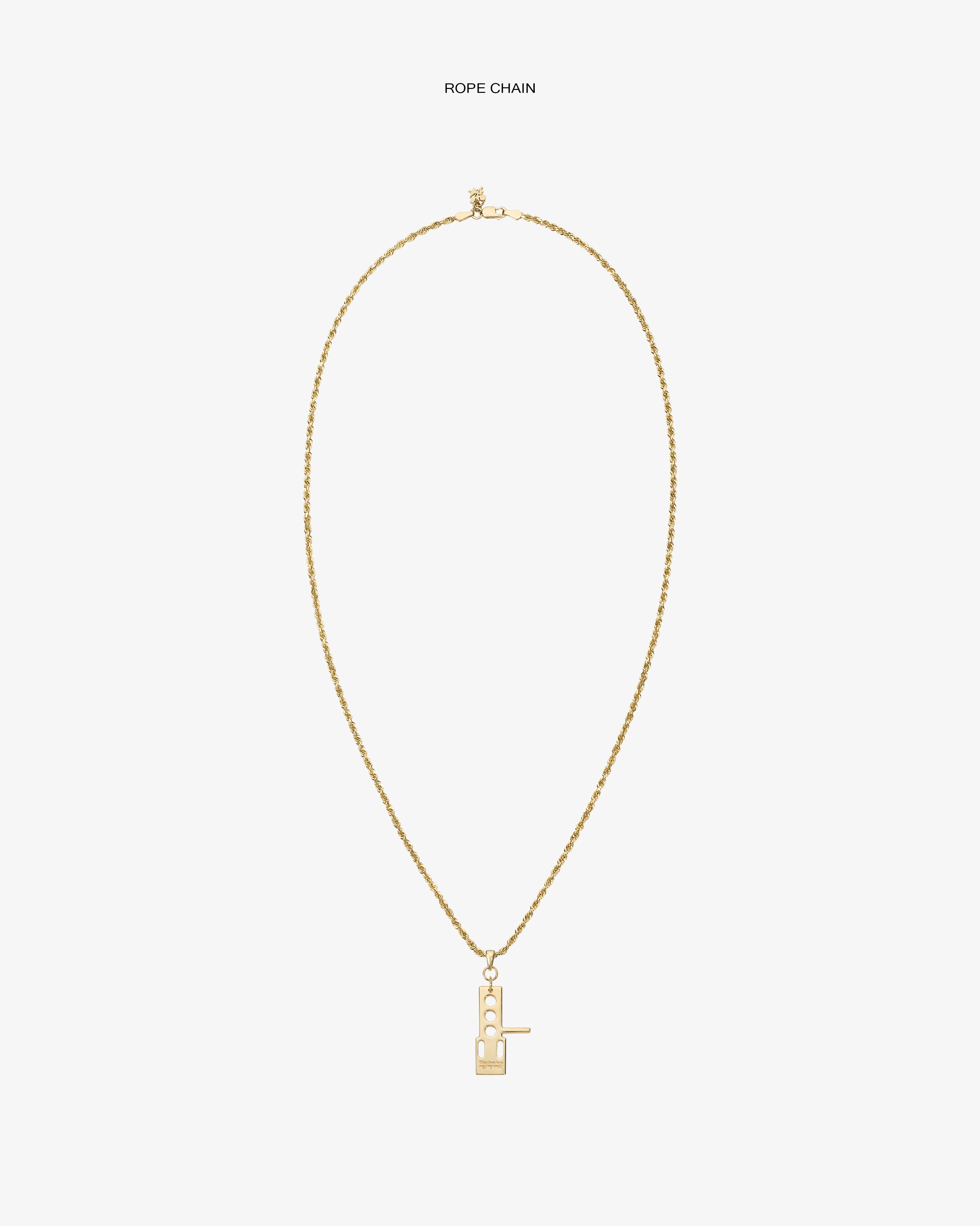 ALD / Technics 14Kt Gold Pendant rope chain necklace with geometric pendant on a plain white background.