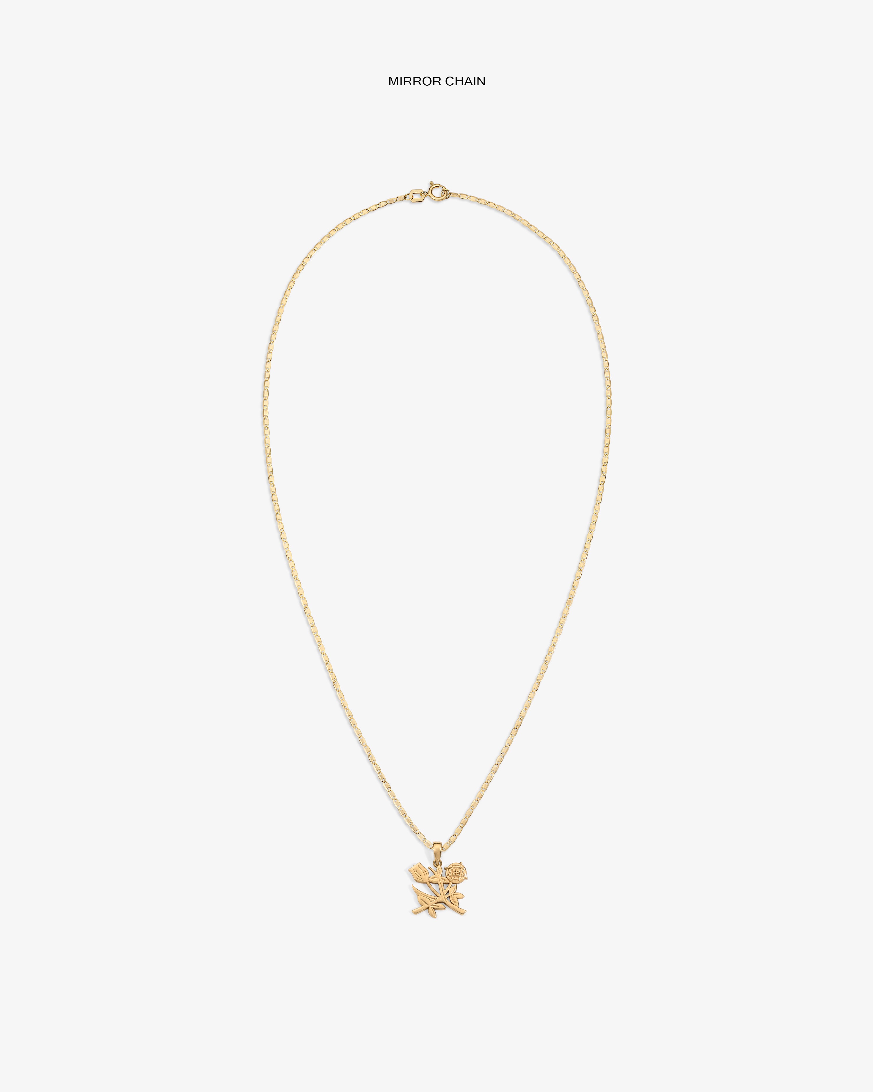 14Kt Gold Pendant: thin twisted chain with two small pendants—a star and a rose.