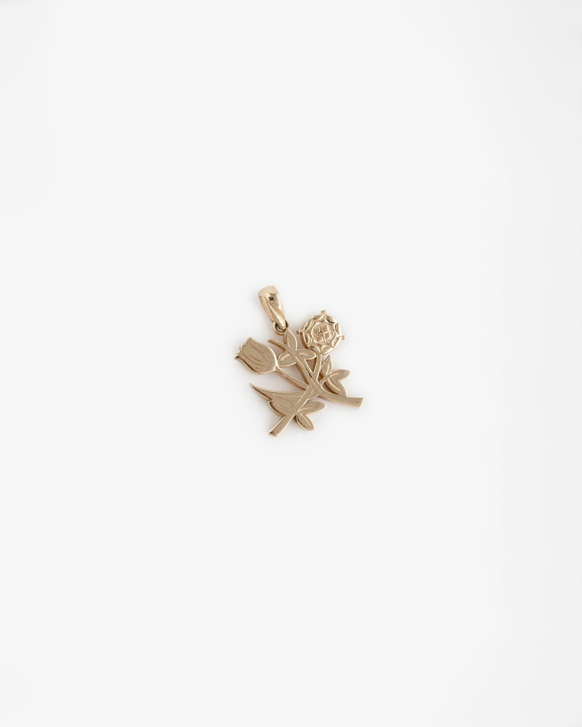 14Kt Gold Pendant shaped like a rose with stem and leaves, shown on a plain white background.