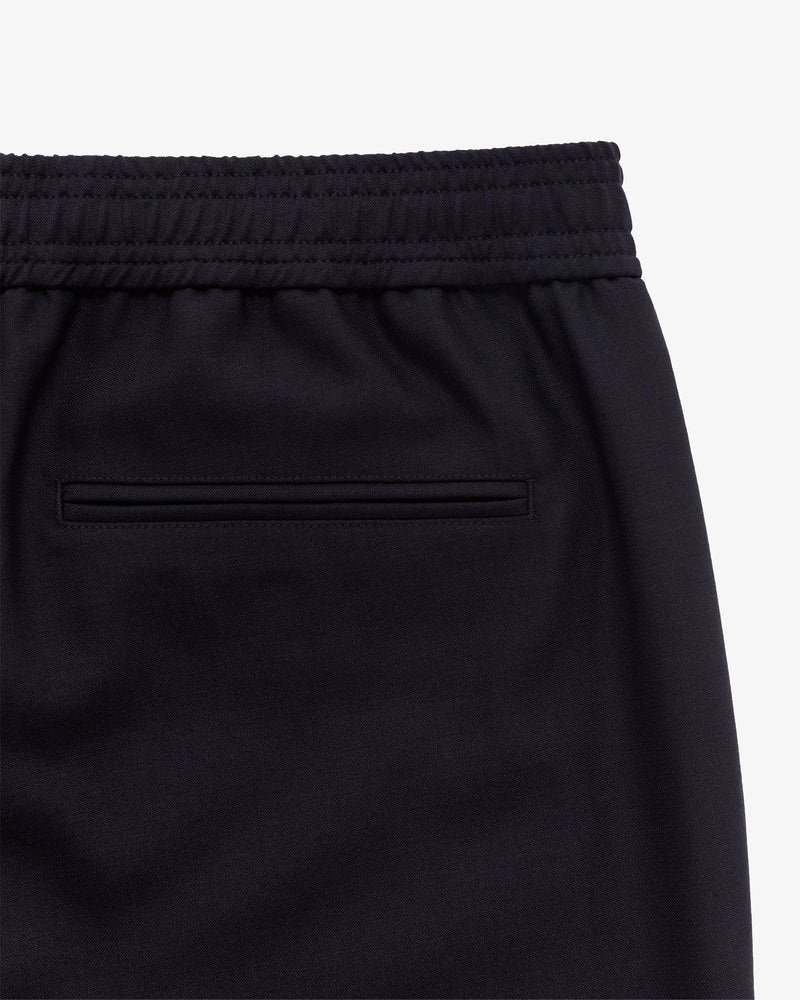 Close-up of the Tropical Wool Elasticated Waist Suit Trouser’s back, showing elastic waist and welt pocket.