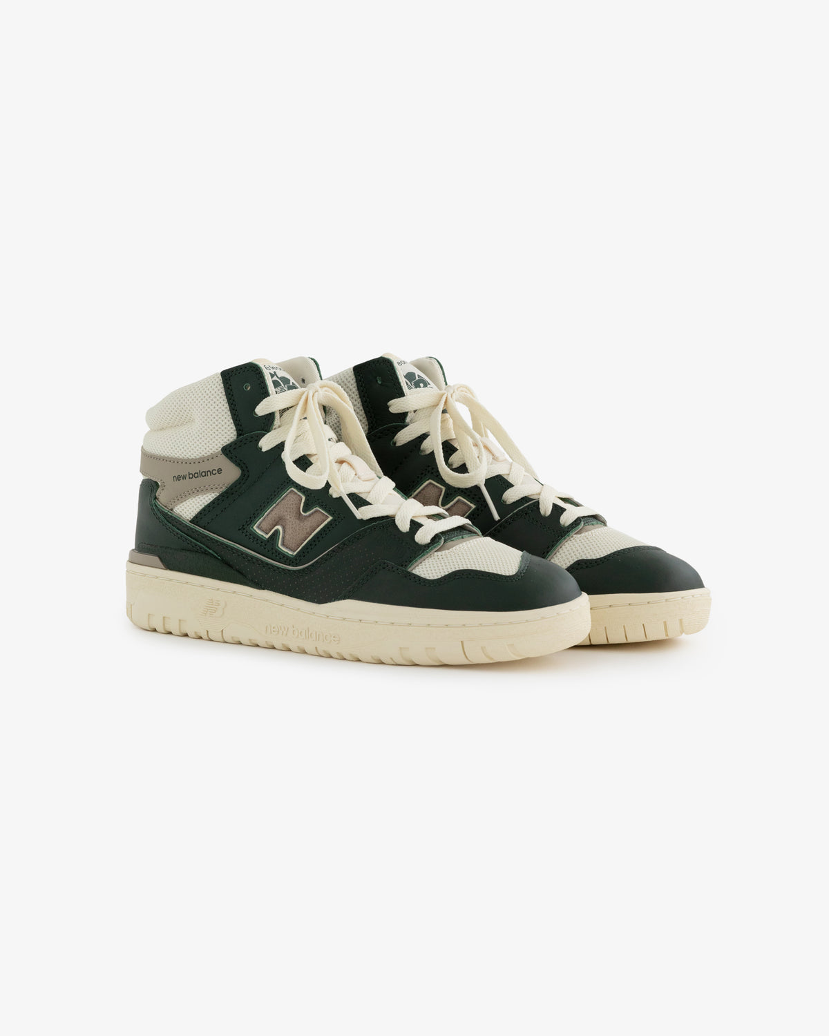 A pair of black, white & beige ALD / New Balance 650R high-top sneakers with laces on a white background.