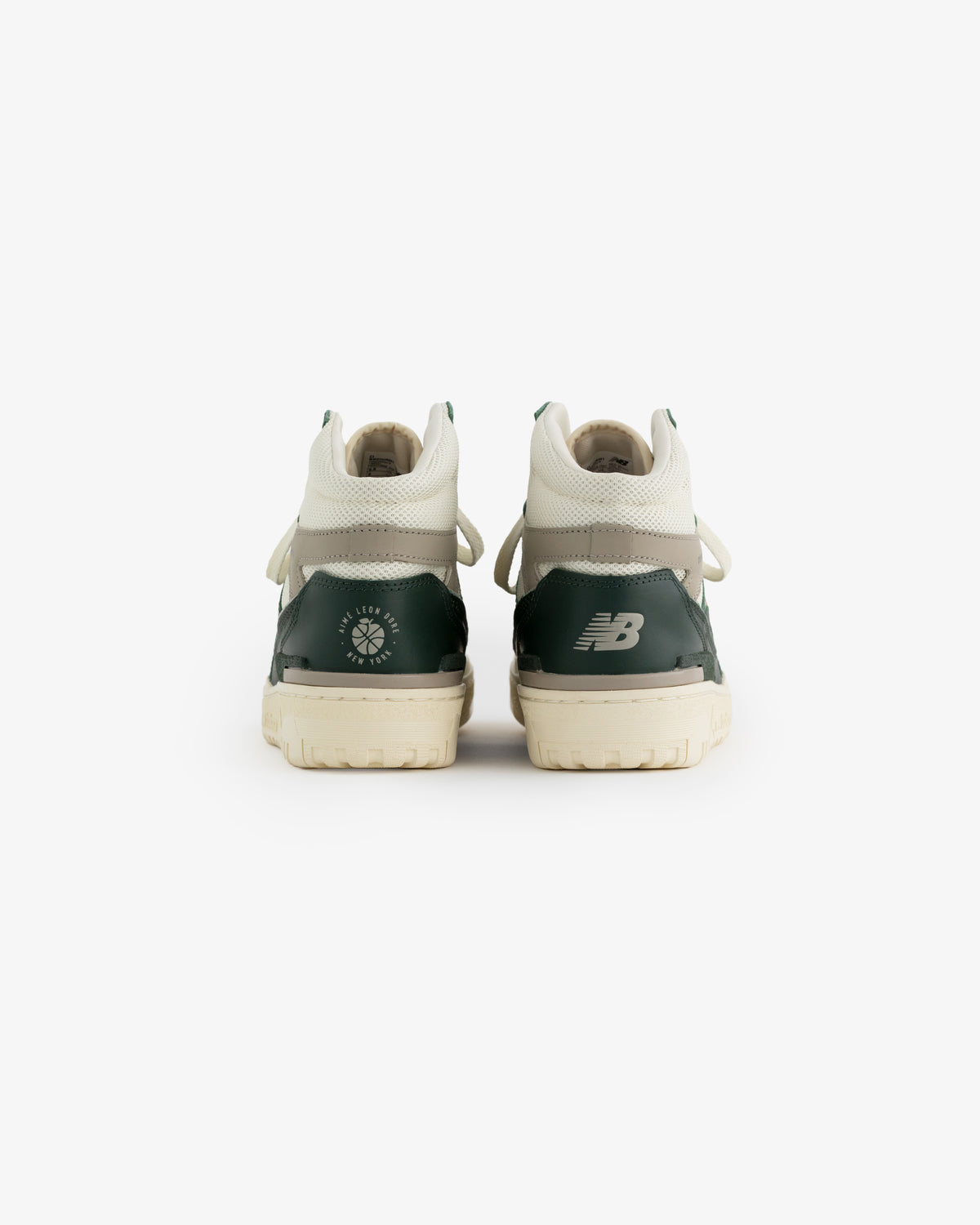 ALD / New Balance 650R green and white sneakers shown from the back on a white background.