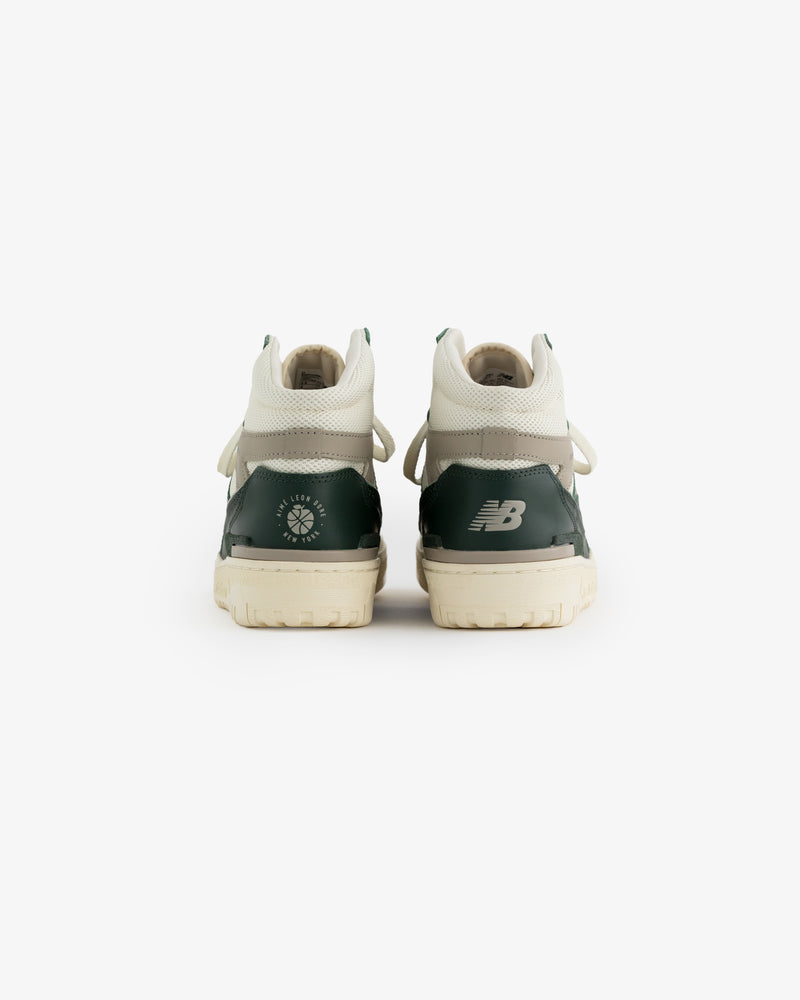 ALD / New Balance 650R green and white sneakers shown from the back on a white background.