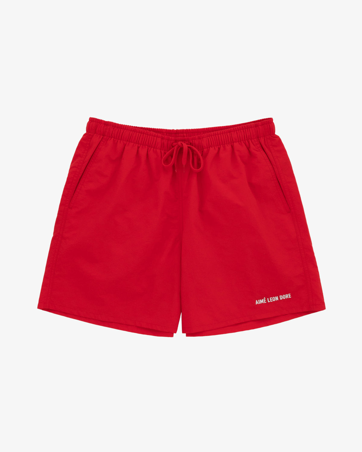Bright red Logo Swim Shorts with side pockets and AIMÉ LEON DORE in white on the left leg.