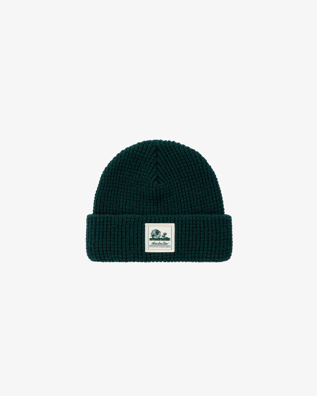 Dark green Waffle Knit Beanie with a folded brim and a white logo patch on the front.